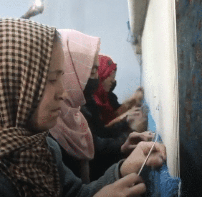 weaving an oriental carpet